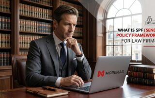 A lawyer in a suit sitting at a desk in a law library, looking at a laptop with the MoreMax logo. Text overlay reads: "What is SPF (Sender Policy Framework) for Law Firms?"